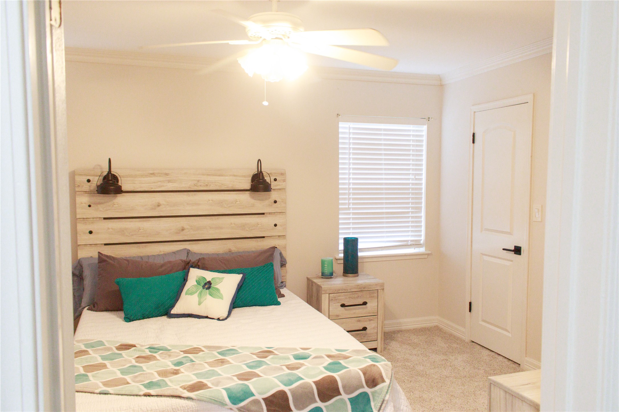 7510 Ralick Court Spring, TX 77379 - Photo 38 of 44 a bedroom with a large bed and a chandelier