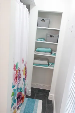 a spacious bedroom with a bed and a window