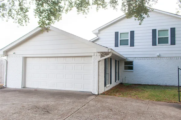 a view of a small white house