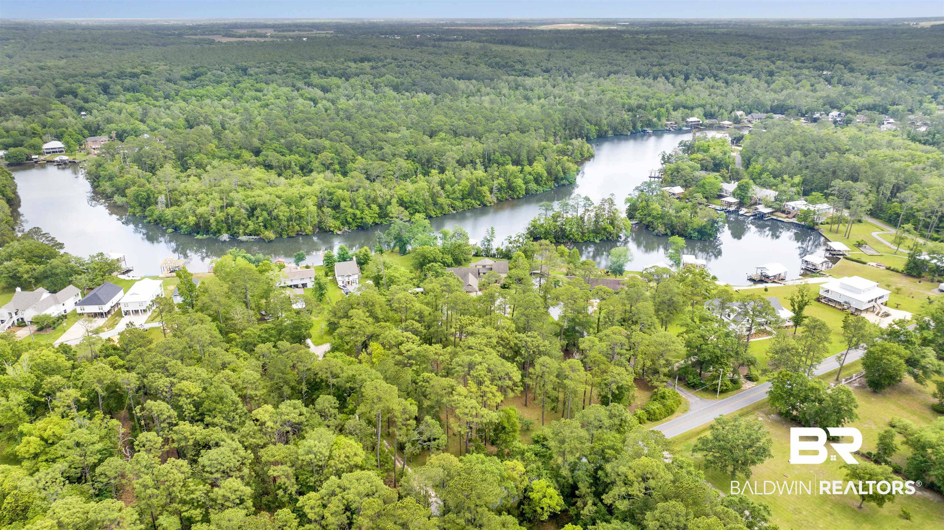 16864 Ferry Rd Circle Fairhope, AL 36532 - Photo 60 of 68 Aerial view of property's location with a heavily wooded area and a nearby body of water