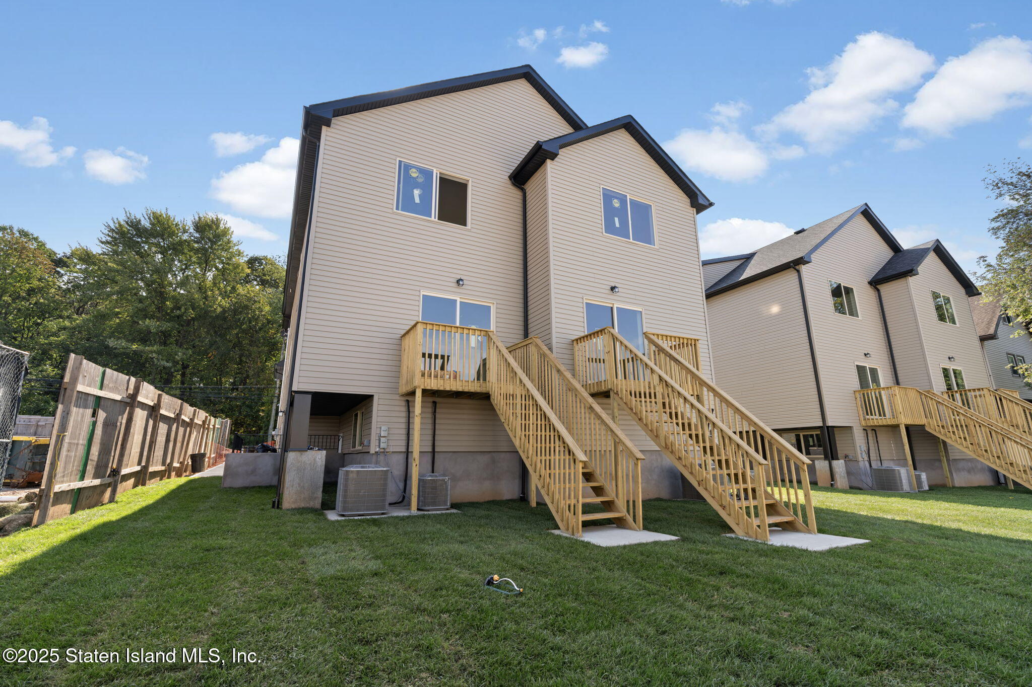 1370 Forest Hill Road, Unit 2B Staten Island, NY 10314 - Photo 18 of 20 a view of a house with a yard