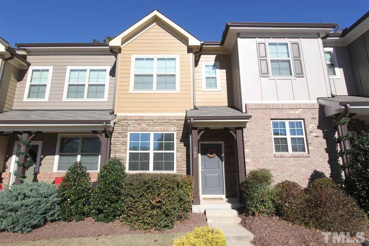 760 Wickham Ridge Road Apex, NC 27539 - Photo 1 of 25 front view of a brick house with a large window