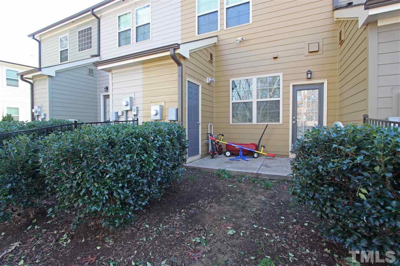 760 Wickham Ridge Road Apex, NC 27539 - Photo 21 of 25 a view of a house with backyard and sitting area