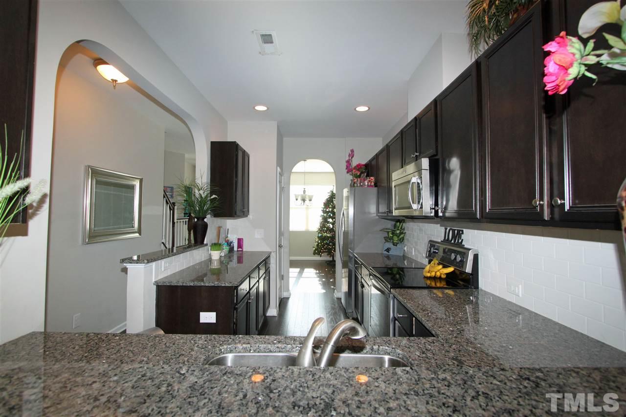 760 Wickham Ridge Road Apex, NC 27539 - Photo 7 of 25 a view of living room kitchen