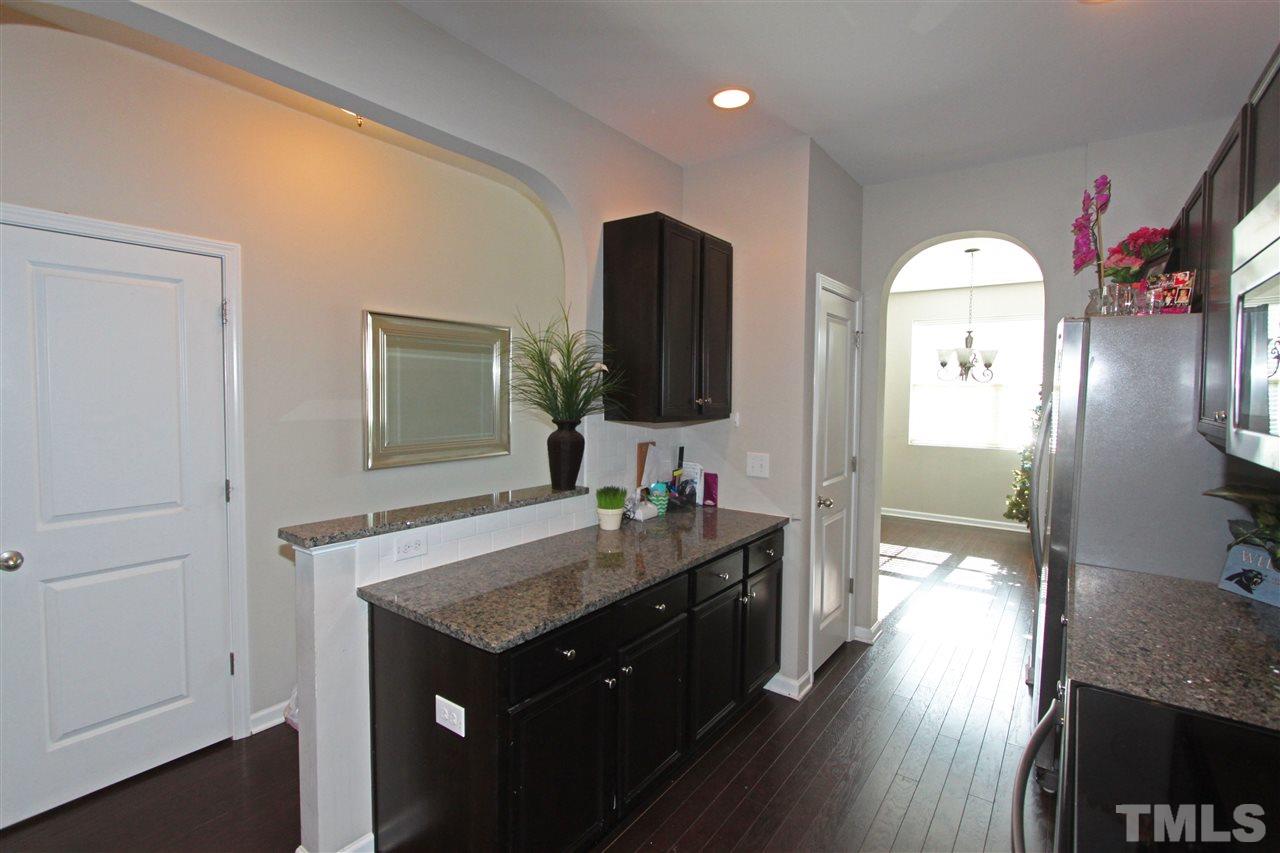 760 Wickham Ridge Road Apex, NC 27539 - Photo 8 of 25 a spacious bathroom with a sink and a mirror