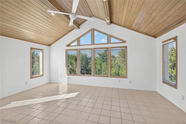 a view of an empty room with windows