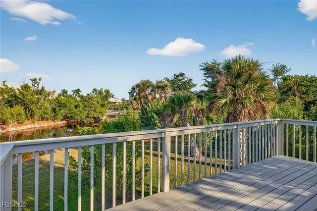 a view of a balcony with wooden fence