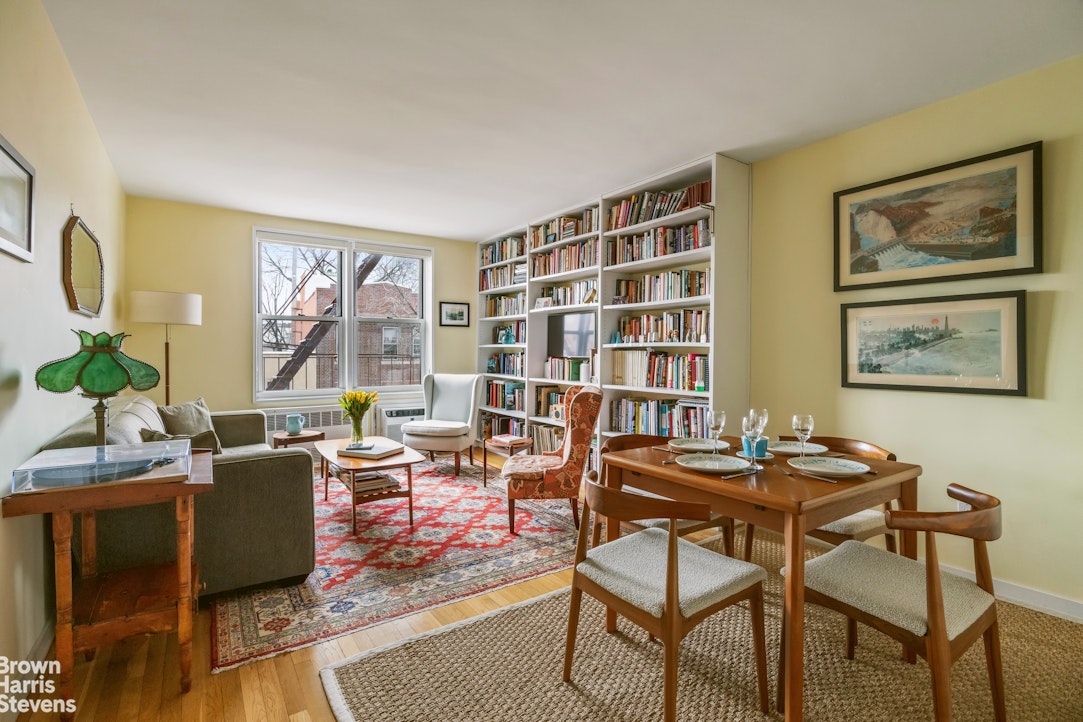 a dining room with furniture and a potted plant
