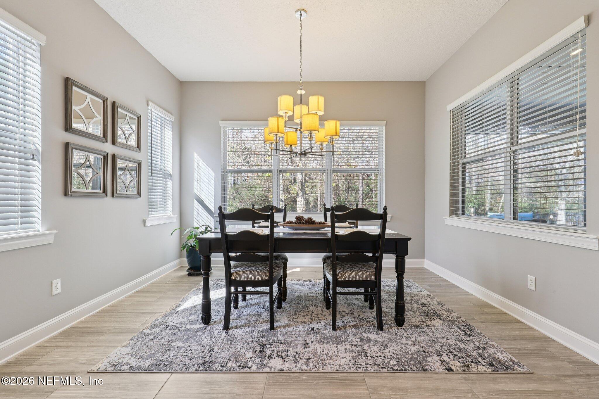 147 Dock House Road St. Johns, FL 32259 - Photo 14 of 67 a view of a dining room with furniture window and wooden floor
