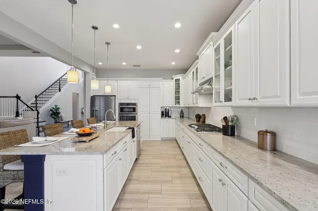 a view of a patio with a dining table and chairs