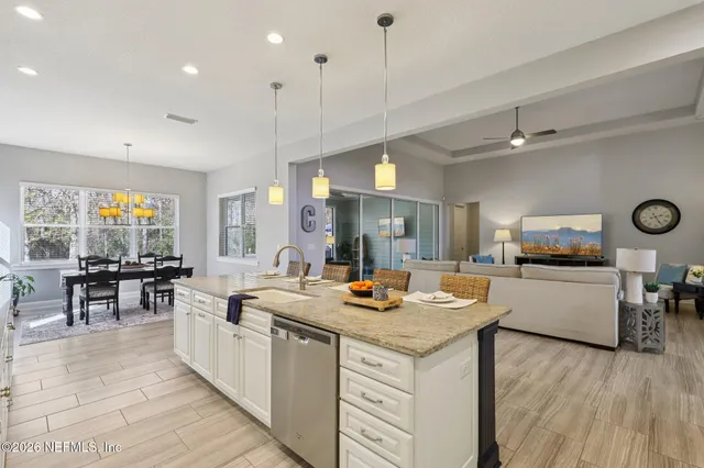 a view of a room with gym equipment and floor to ceiling window