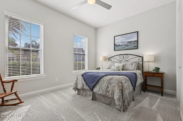 a front view of a house with swimming pool and glass windows