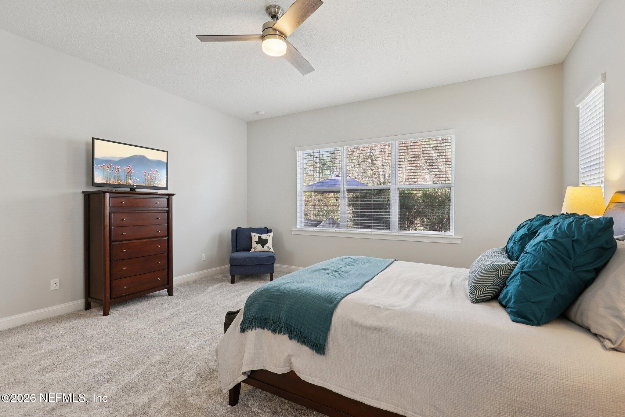 147 Dock House Road St. Johns, FL 32259 - Photo 29 of 67 a bedroom with a bed and a window