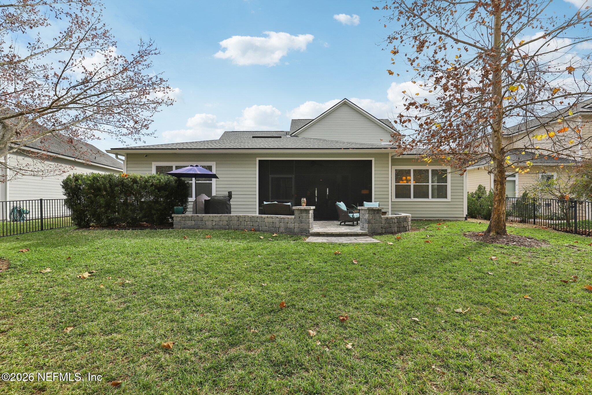 147 Dock House Road St. Johns, FL 32259 - Photo 48 of 67 a front view of house with yard and outdoor seating