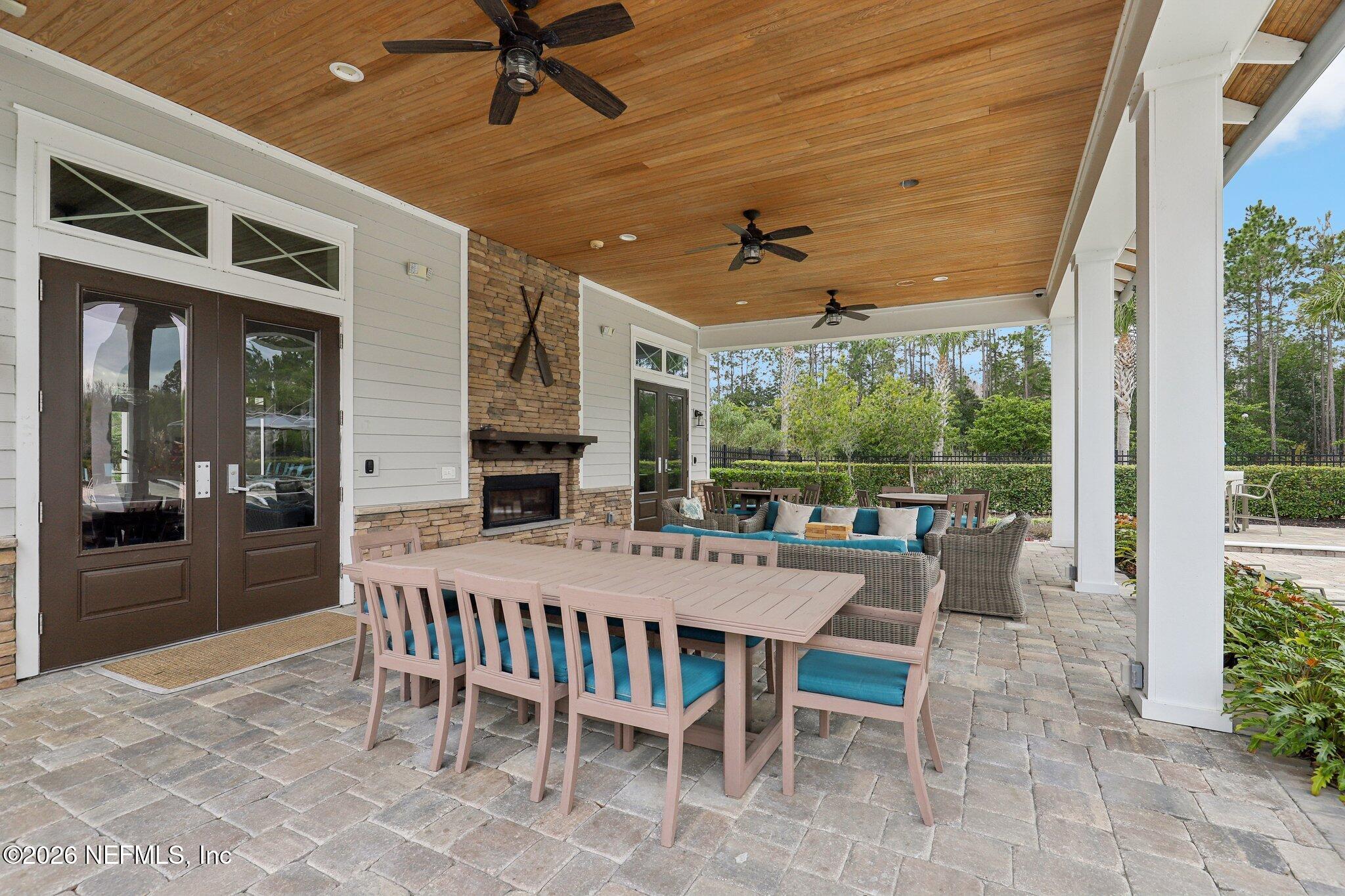 147 Dock House Road St. Johns, FL 32259 - Photo 52 of 67 a view of a patio with a dining table and chairs