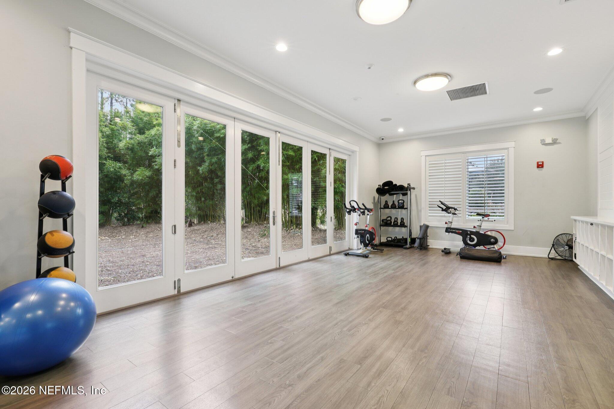 147 Dock House Road St. Johns, FL 32259 - Photo 55 of 67 a view of a room with gym equipment and floor to ceiling window