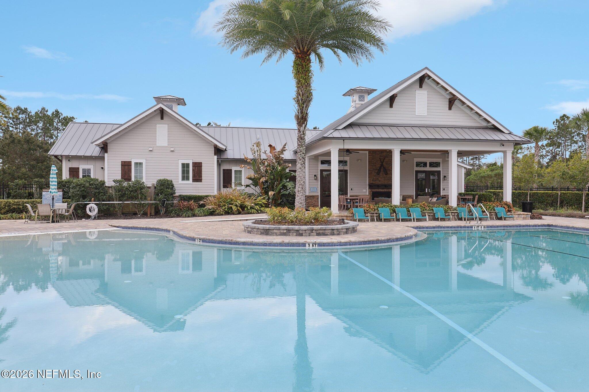 147 Dock House Road St. Johns, FL 32259 - Photo 58 of 67 a front view of a house with swimming pool and glass windows