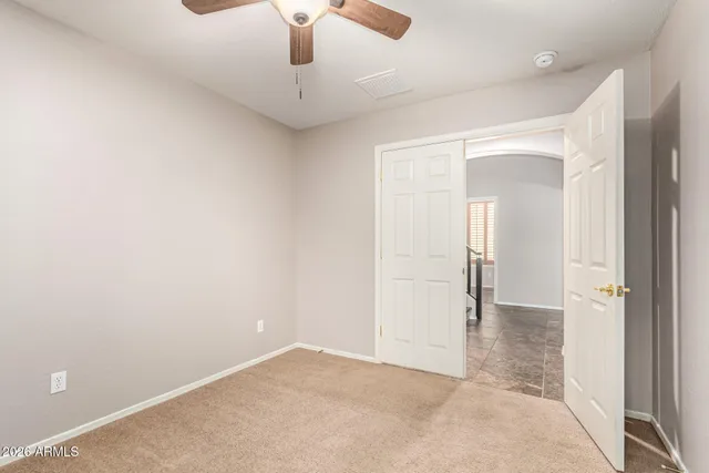 an empty room with fan