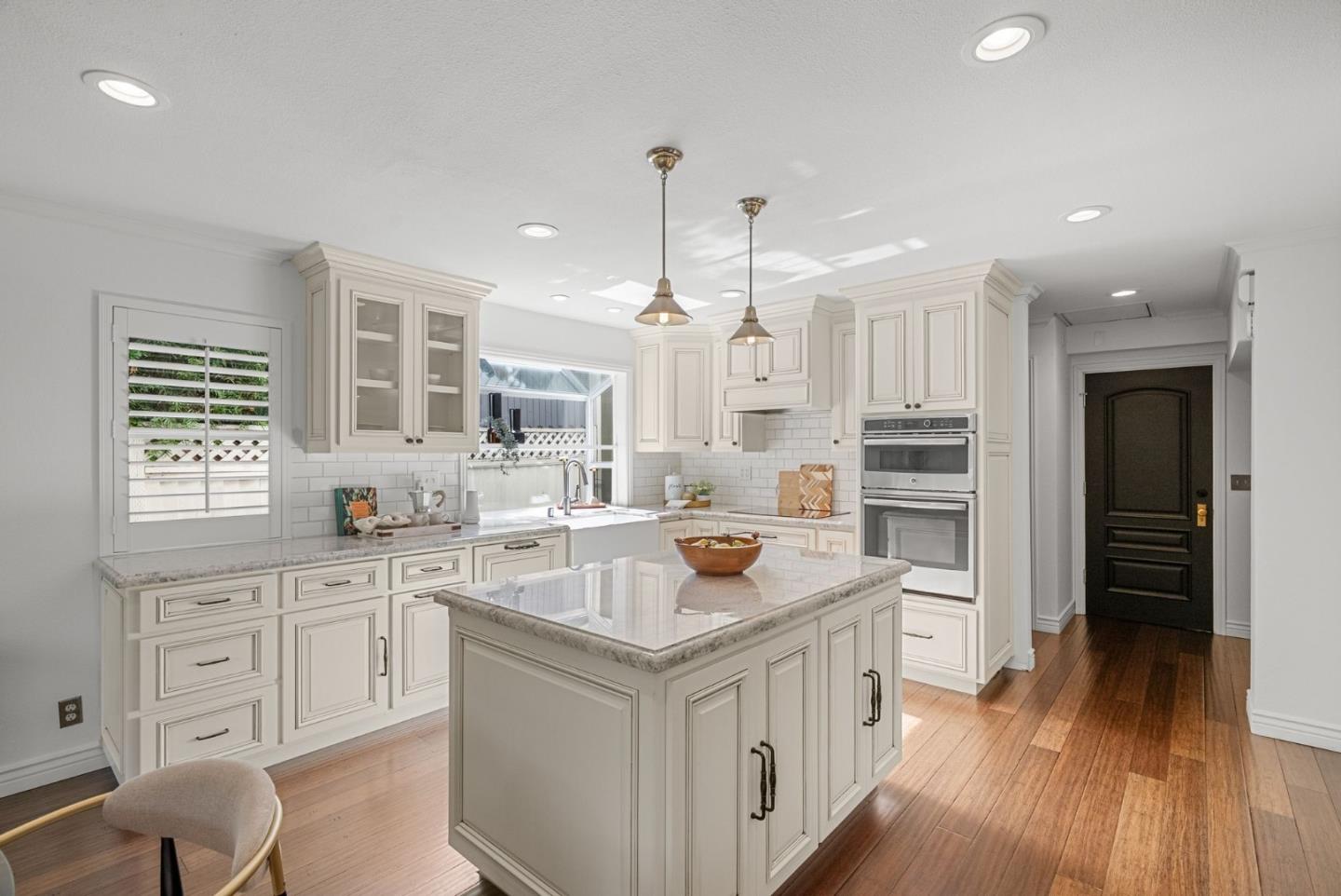 1147 Longshore Drive San Jose, CA 95128 - Photo 1 of 28 a kitchen with white cabinets and stainless steel appliances