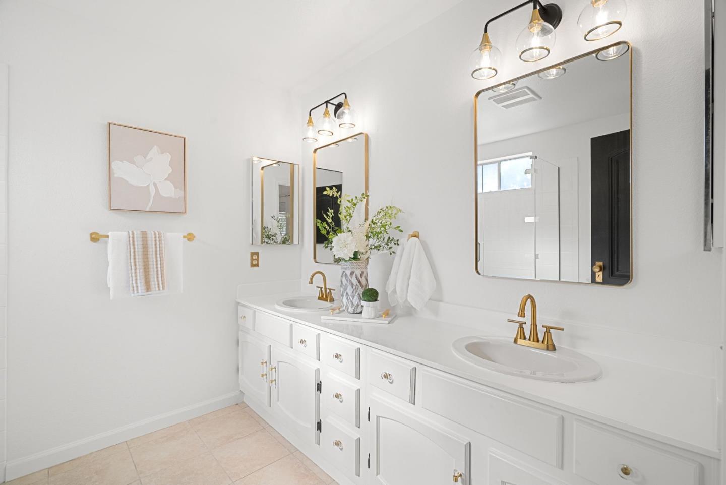 1147 Longshore Drive San Jose, CA 95128 - Photo 14 of 28 a bathroom with double vanity sink a mirror and vanity