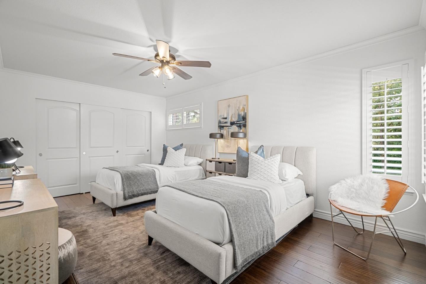 1147 Longshore Drive San Jose, CA 95128 - Photo 16 of 28 a bedroom with a bed and a chandelier