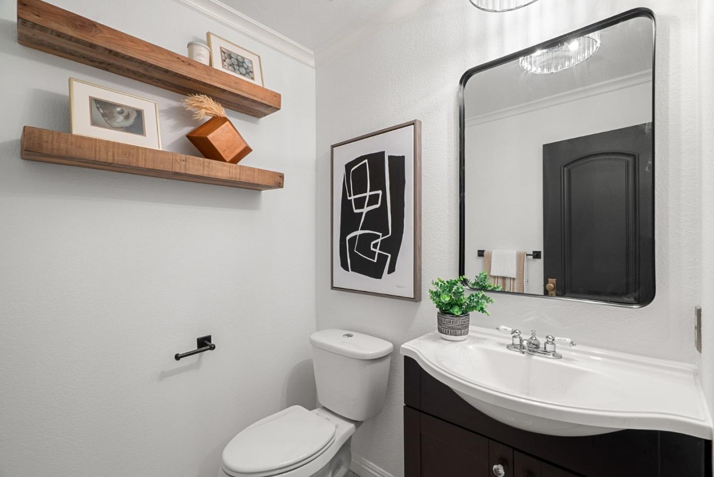 1147 Longshore Drive San Jose, CA 95128 - Photo 18 of 28 a bathroom with a toilet sink and mirror