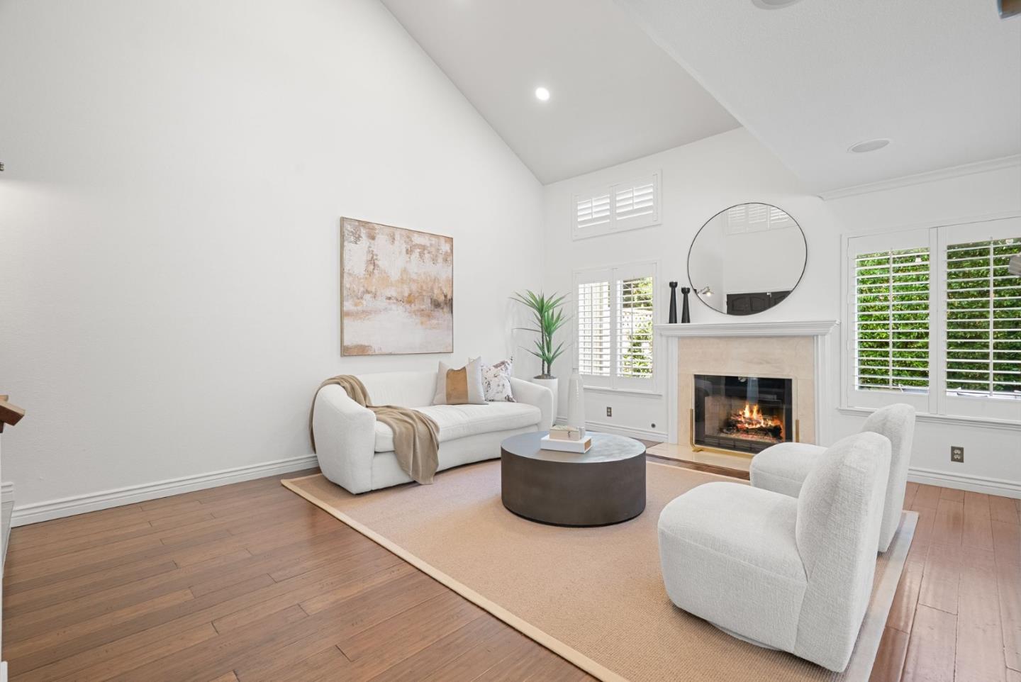 1147 Longshore Drive San Jose, CA 95128 - Photo 9 of 28 a living room with furniture a fireplace and a large window