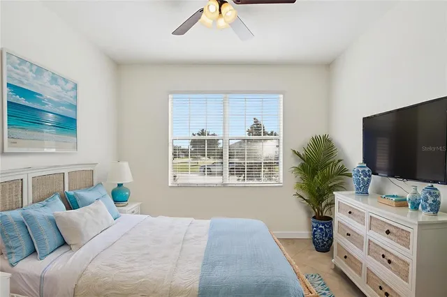 a large kitchen with stainless steel appliances granite countertop a sink counter space cabinets and a large window