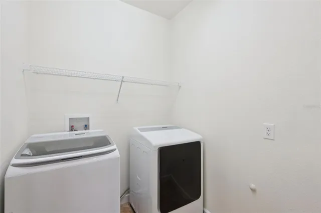 an aerial view of residential house with outdoor space and swimming pool