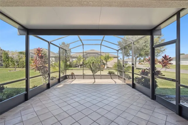 an aerial view of a house with yard swimming pool and outdoor seating
