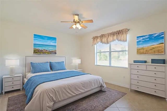 a bedroom with bed and window