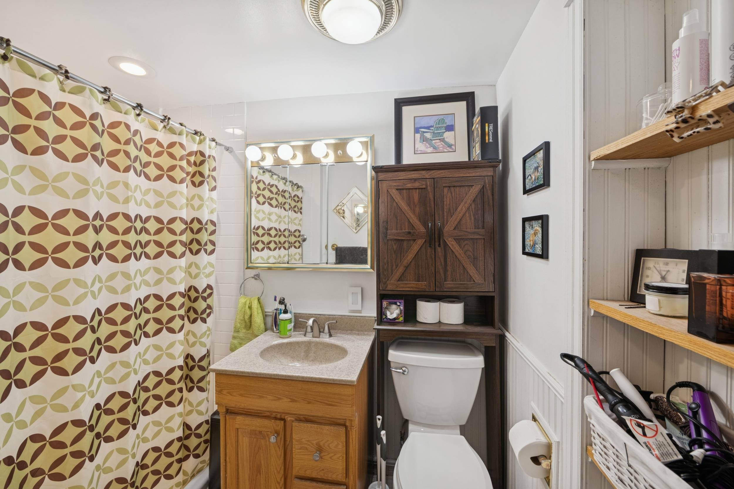220 5th Avenue West Washburn, WI 54891 - Photo 15 of 38 Bathroom featuring vanity and a shower with curtain