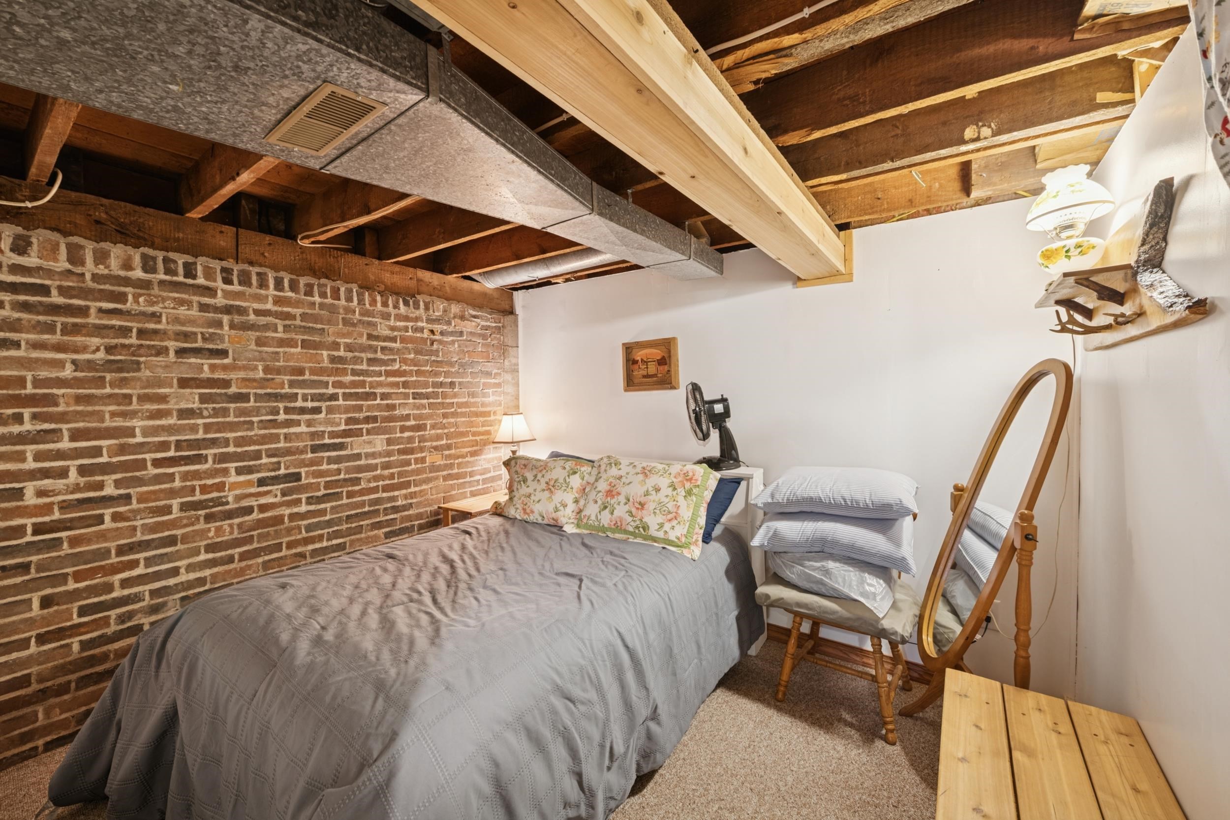 220 5th Avenue West Washburn, WI 54891 - Photo 20 of 38 Bedroom featuring brick wall and carpet