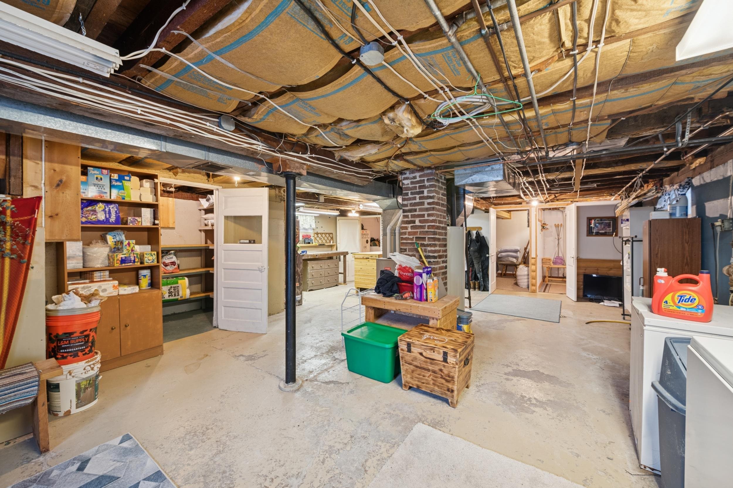 220 5th Avenue West Washburn, WI 54891 - Photo 28 of 38 Unfinished basement featuring white fridge