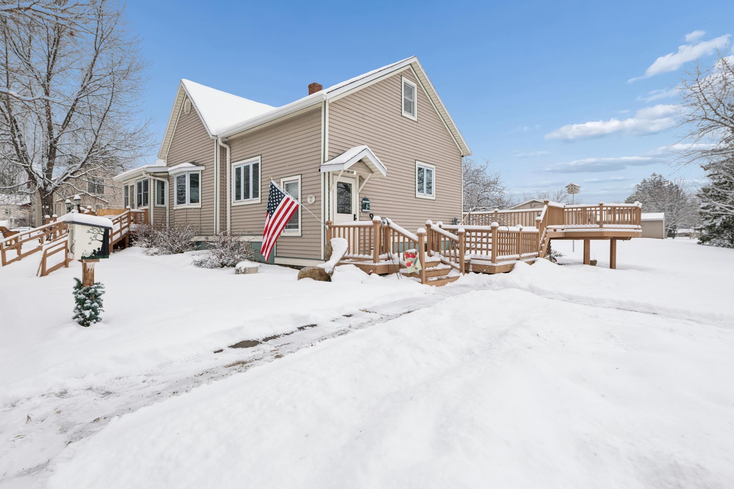 220 5th Avenue West Washburn, WI 54891 - Photo 31 of 38 Snow covered back of property with a deck and a chimney