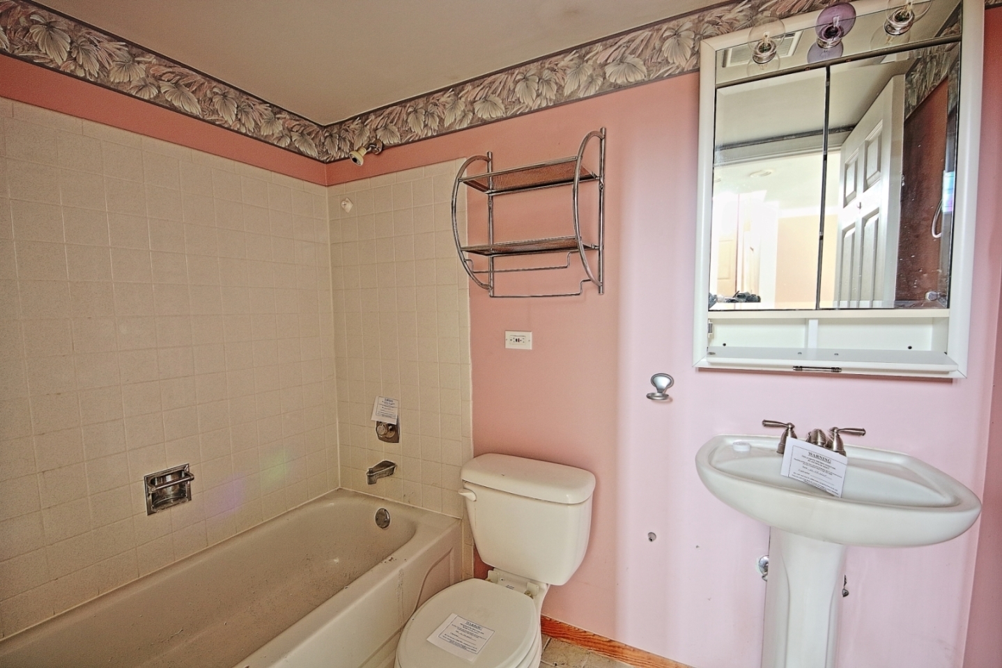 234 Windsor Drive Bolingbrook, IL 60440 - Photo 14 of 22 a bathroom with a sink a toilet and shower