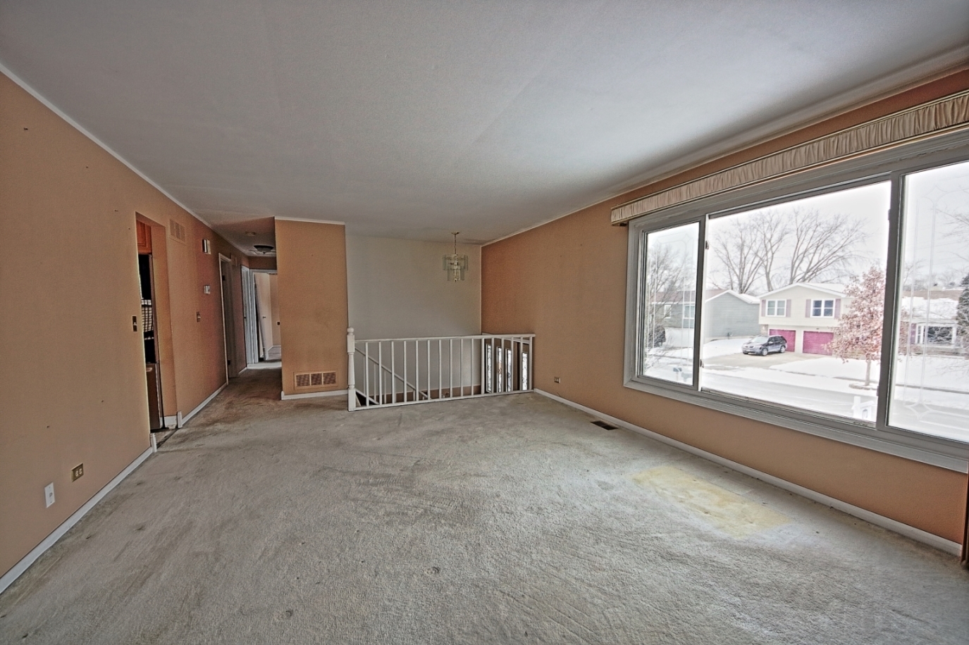 234 Windsor Drive Bolingbrook, IL 60440 - Photo 3 of 22 a view of a livingroom with an empty space and a window