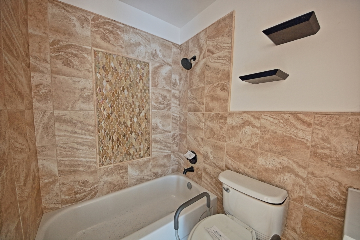 234 Windsor Drive Bolingbrook, IL 60440 - Photo 9 of 22 a bathroom with a toilet and a shower