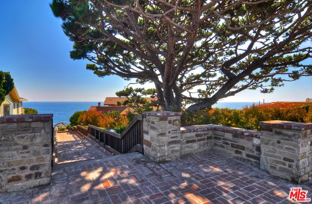 a view of a backyard of the house