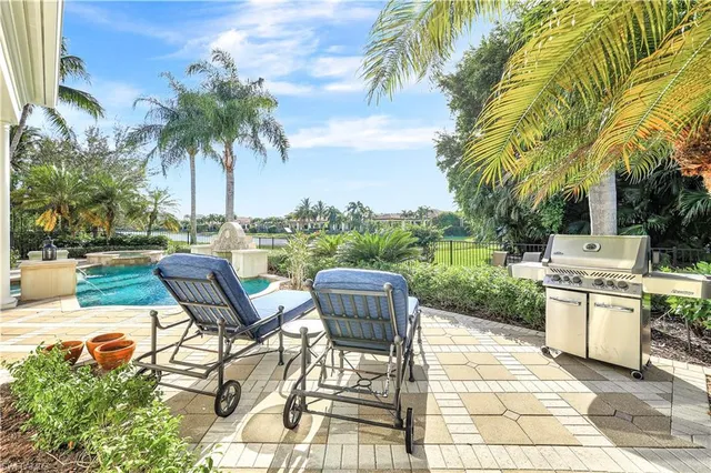 a view of a patio with a table chairs and a patio