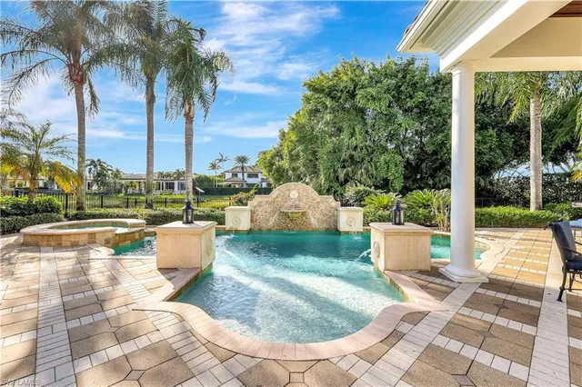 a view of a swimming pool with a patio