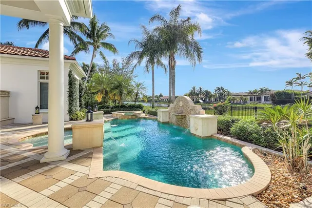 a view of a swimming pool with a patio