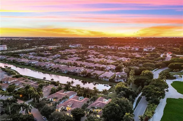 an aerial view of city and ocean