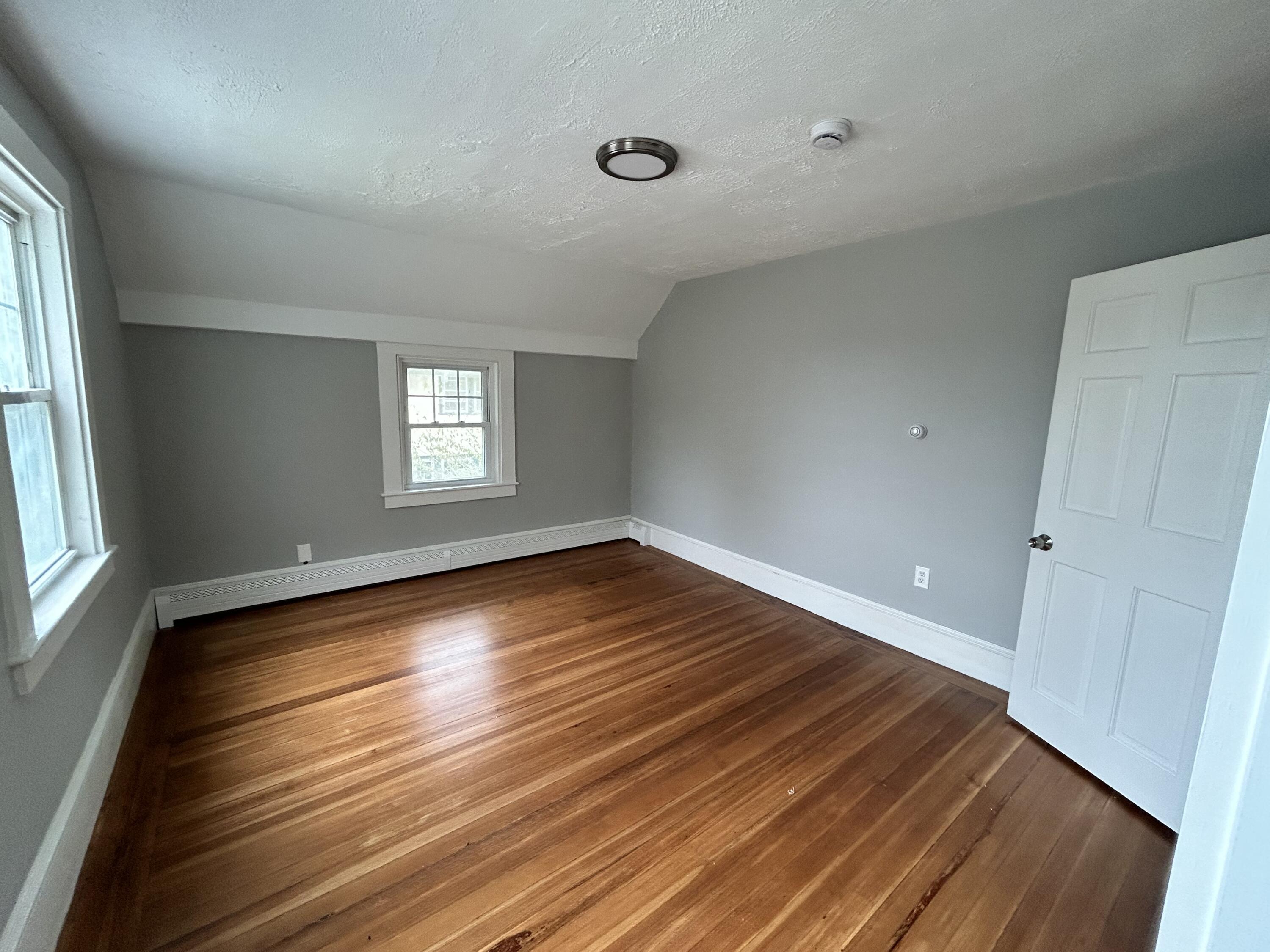 83 Marion Road Wareham, MA 02571 - Photo 12 of 32 wooden floor in an empty room with a window