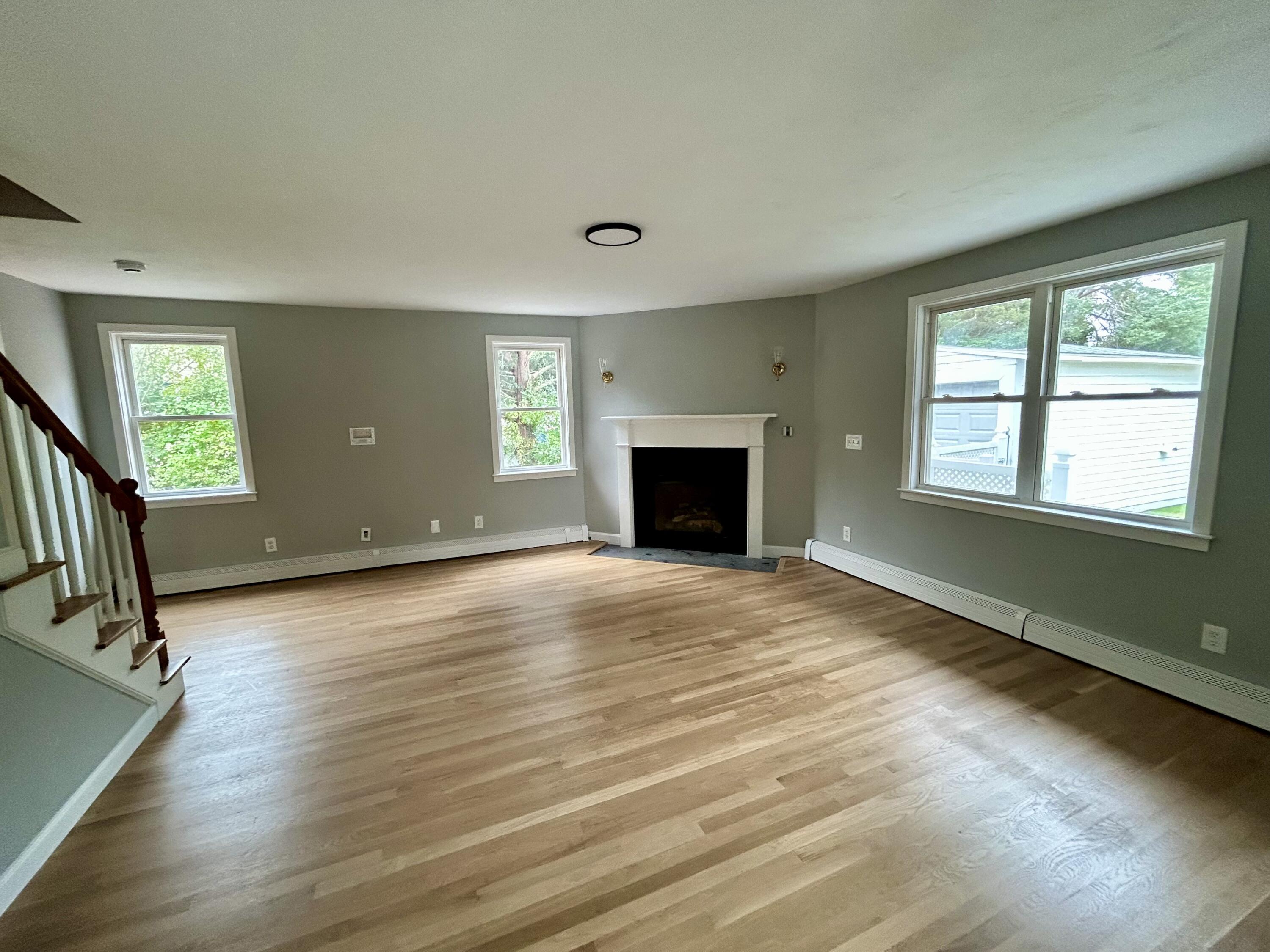 83 Marion Road Wareham, MA 02571 - Photo 16 of 32 a view of an empty room with window and wooden floor
