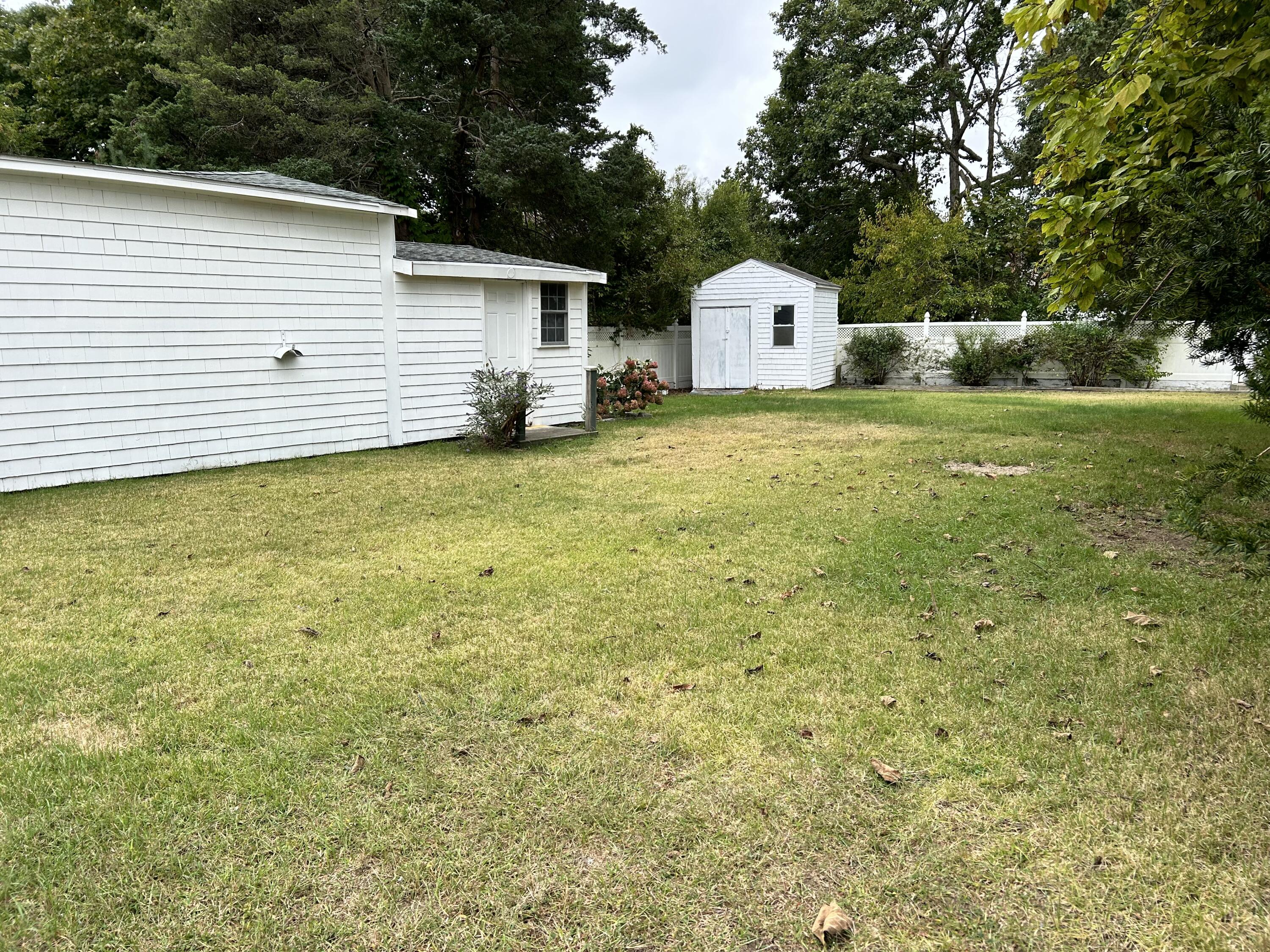 83 Marion Road Wareham, MA 02571 - Photo 26 of 32 a view of a white house with a yard