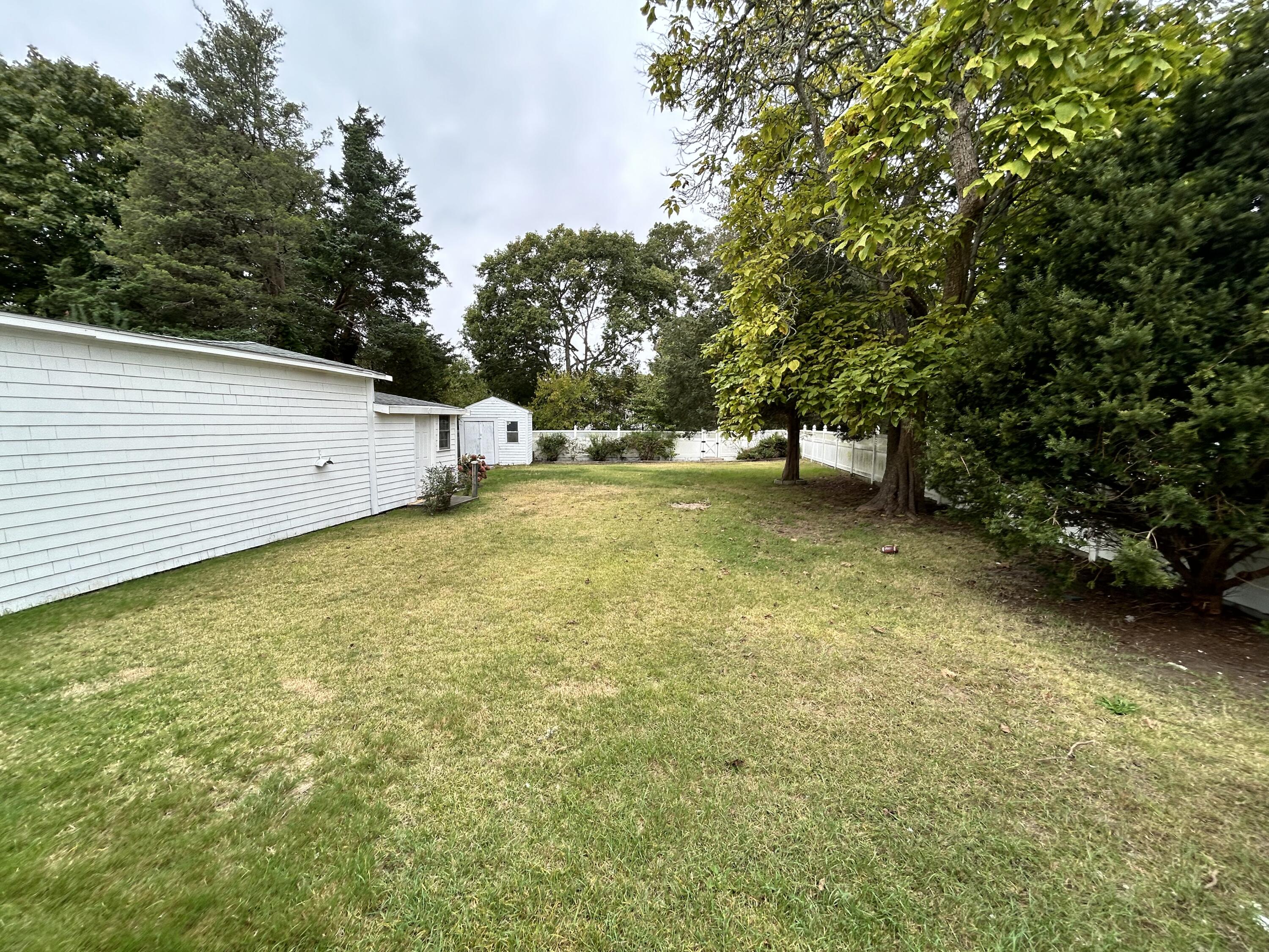 83 Marion Road Wareham, MA 02571 - Photo 27 of 32 a view of a yard with an outdoor space