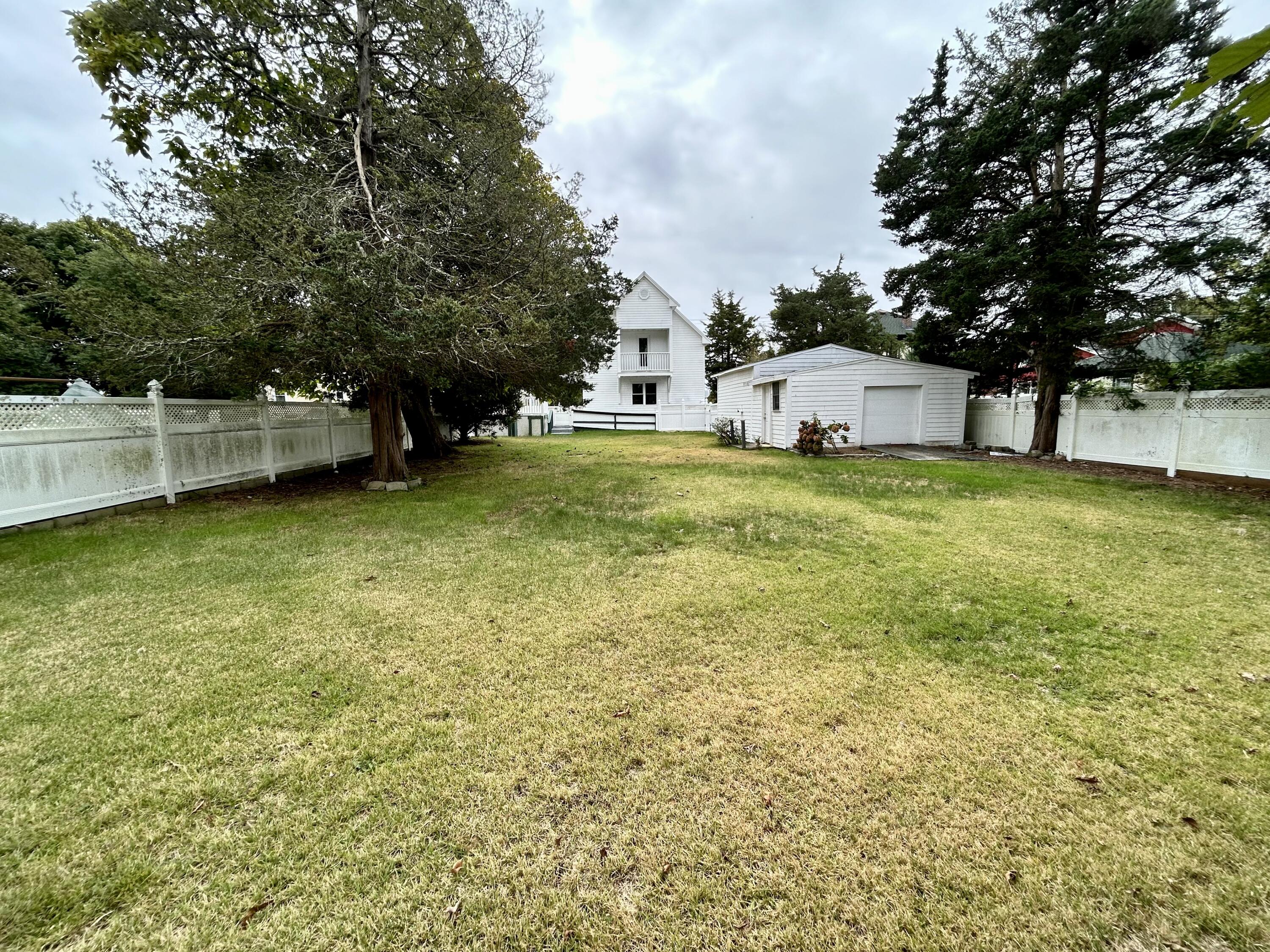 83 Marion Road Wareham, MA 02571 - Photo 31 of 32 a view of a house with a yard and sitting area