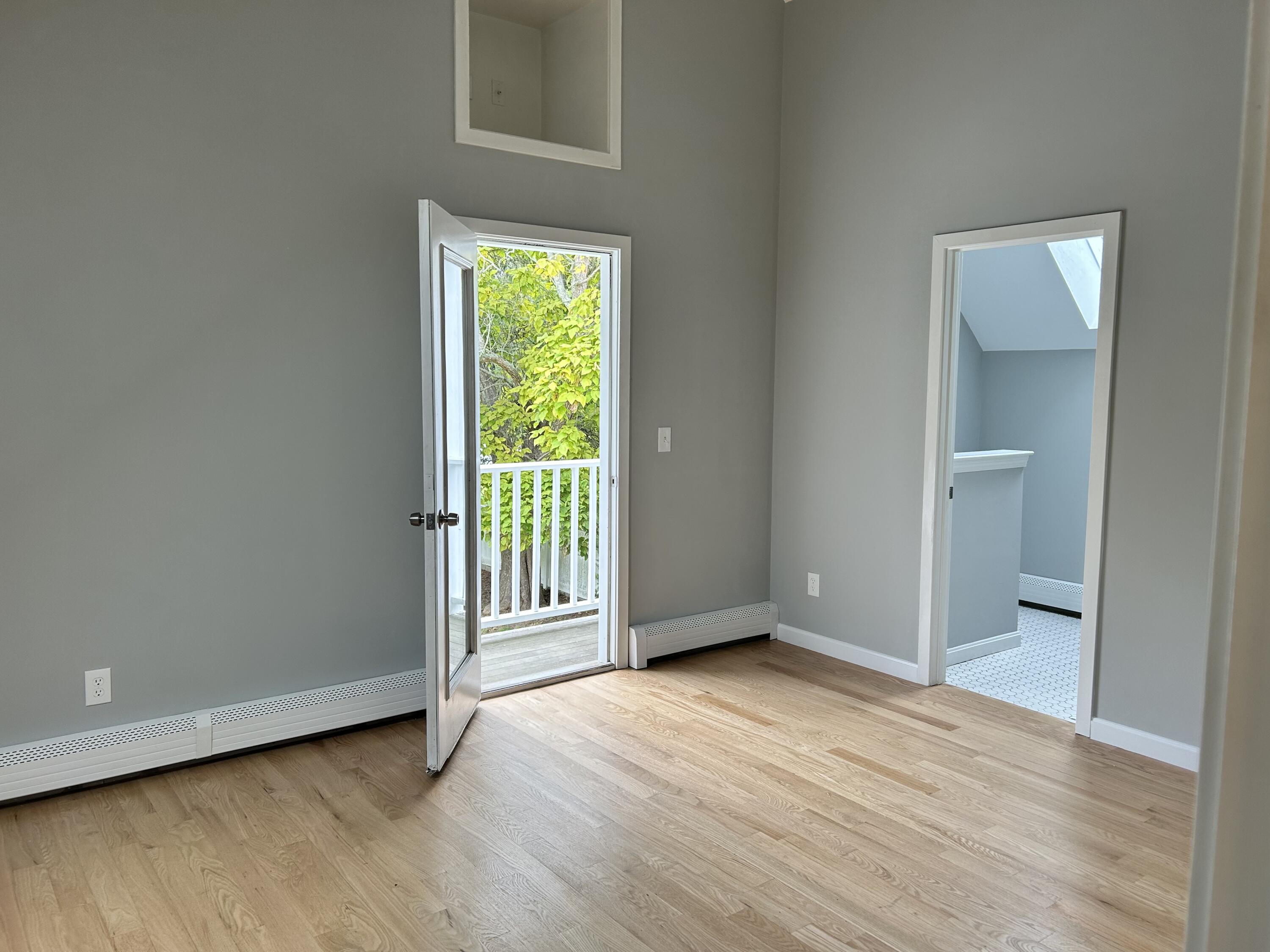 83 Marion Road Wareham, MA 02571 - Photo 6 of 32 an empty room with wooden floor and windows