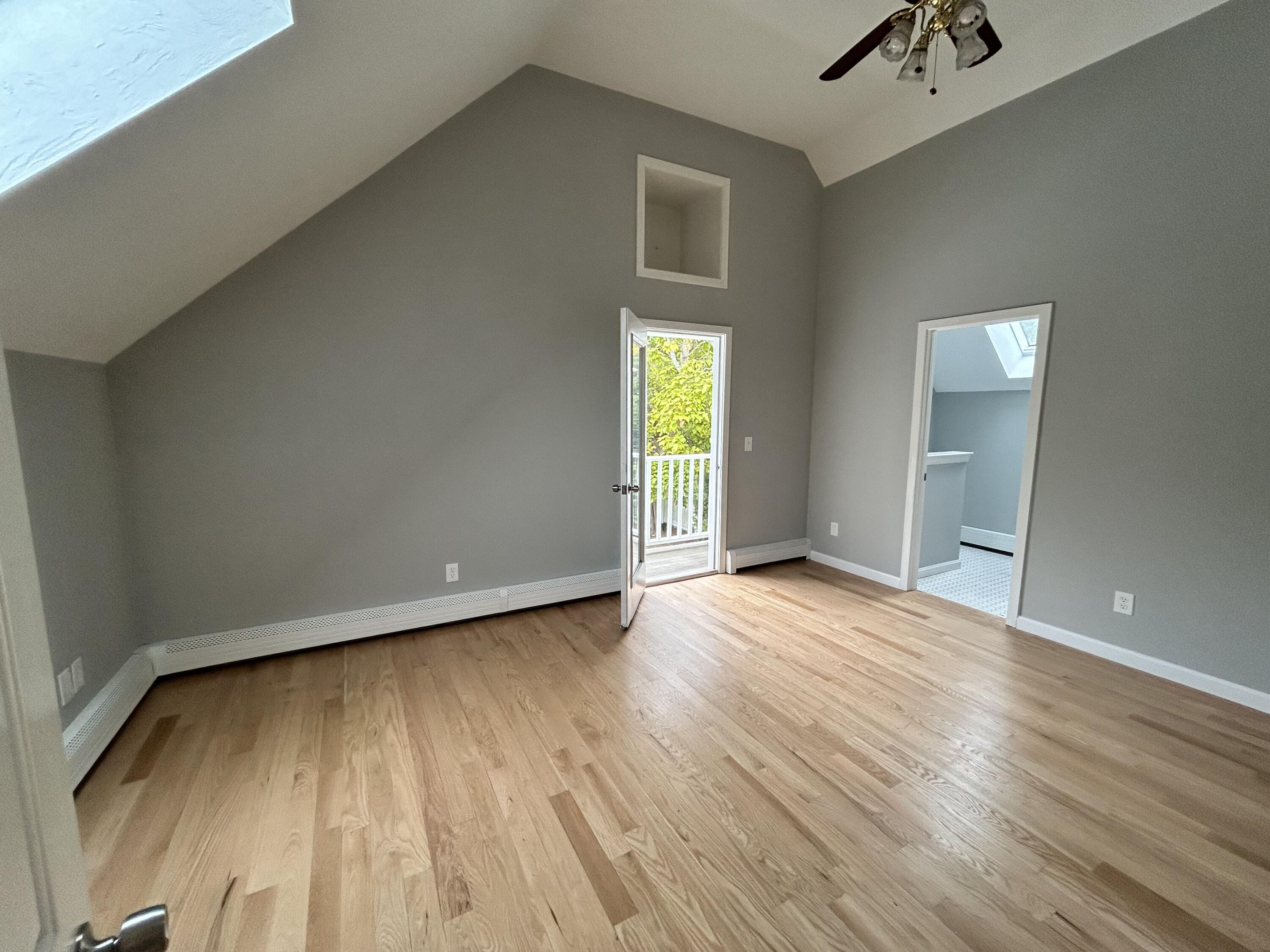 83 Marion Road Wareham, MA 02571 - Photo 9 of 32 an empty room with wooden floor and windows
